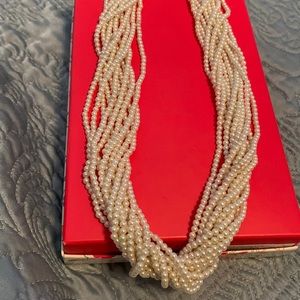 20 inch gold tone small pearl torsade. Pearls are hot right now!